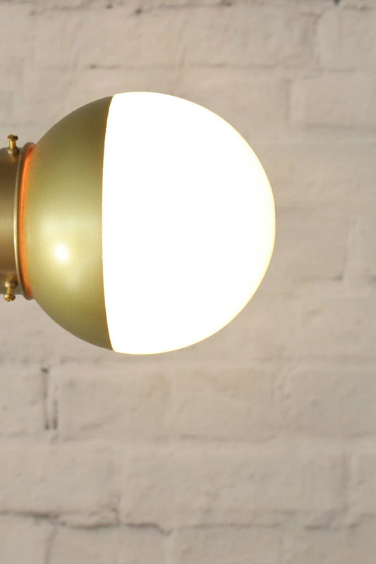 Crown Sphere Light with a gold gallery and a gold and opal shade