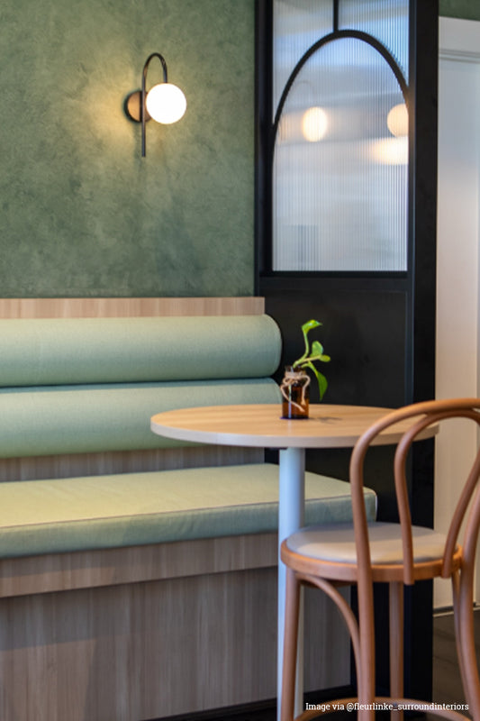 2 wall lights are flanking a restaurant wall. accent lighting.  modern classic styling 