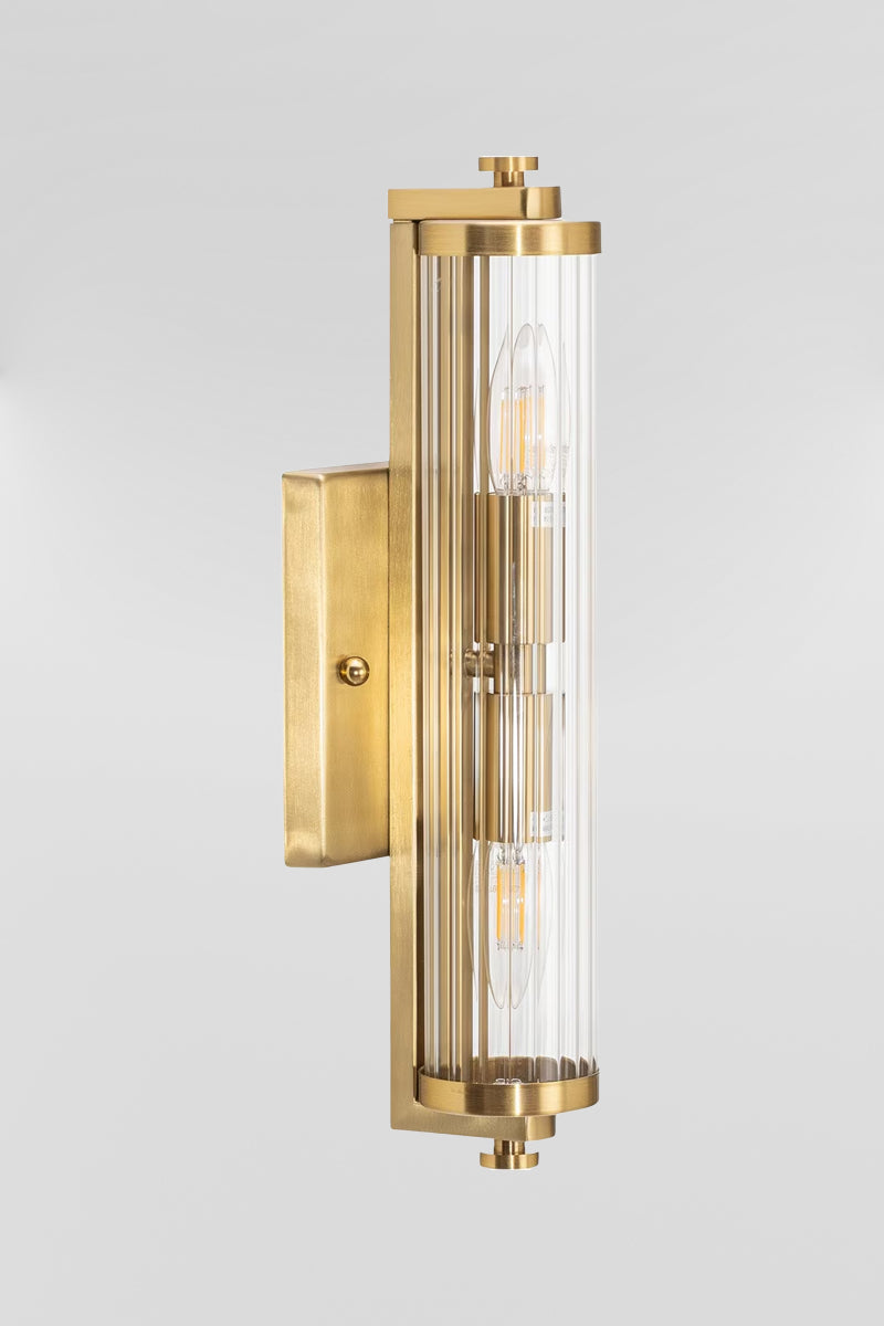Art deco wall  light with clear glass and a steel satin brass finished bracket. 