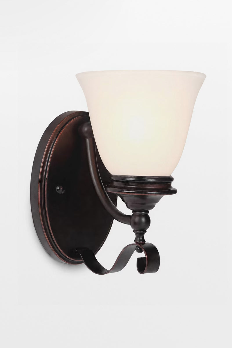 Bronze opal glass wall light with the light on. 