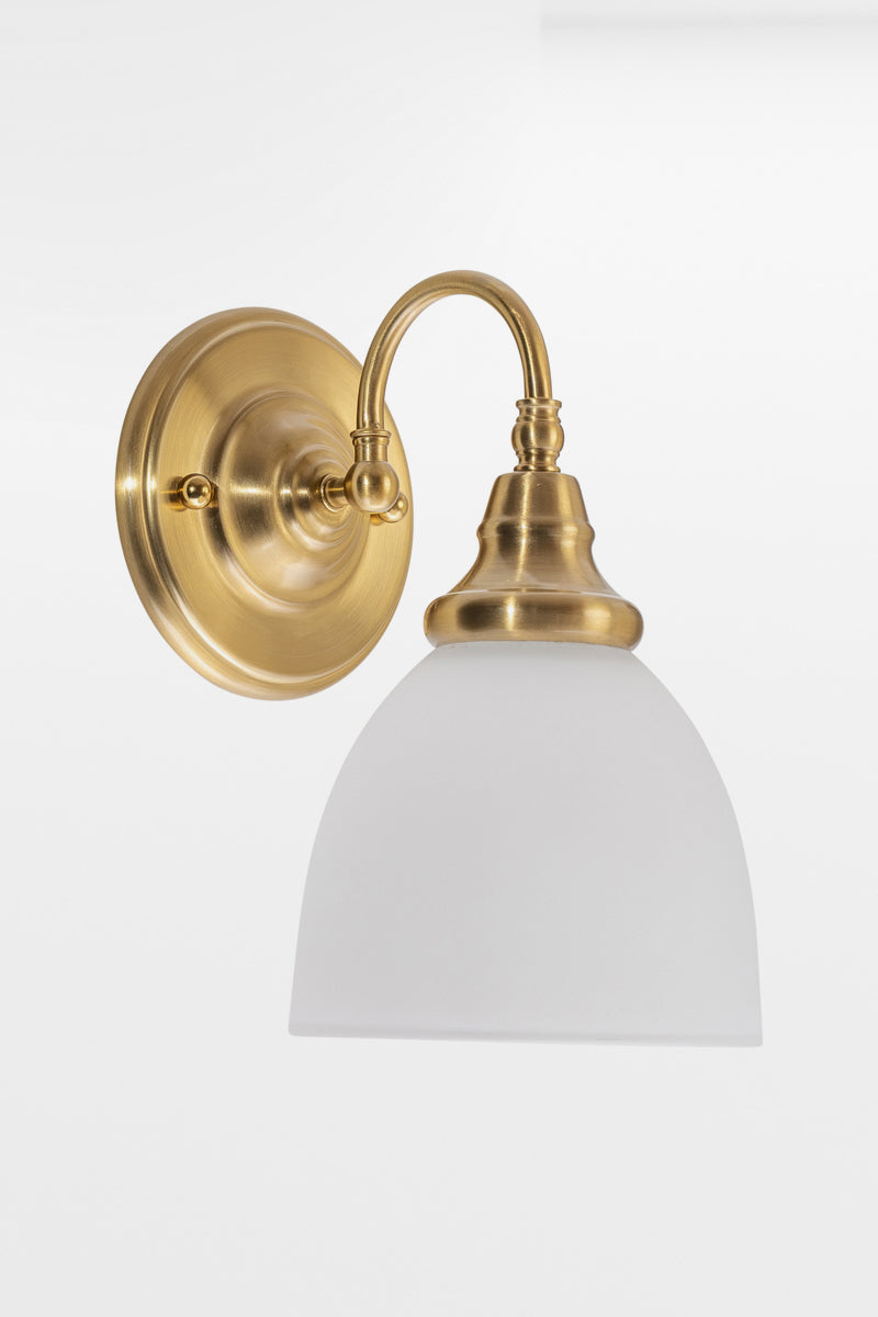 Satin Brass wall sconce with gooseneck arm facing down and an opal shade. 