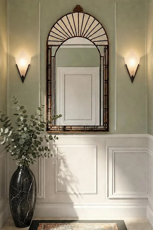 A pair of Ritz Deco Glass Wall Lights lit up and affixed on either sides of a mirror. 