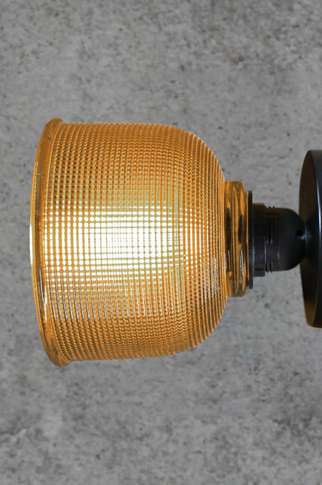 Amber-holophane-glass-wall-light-with-black-batten-holder