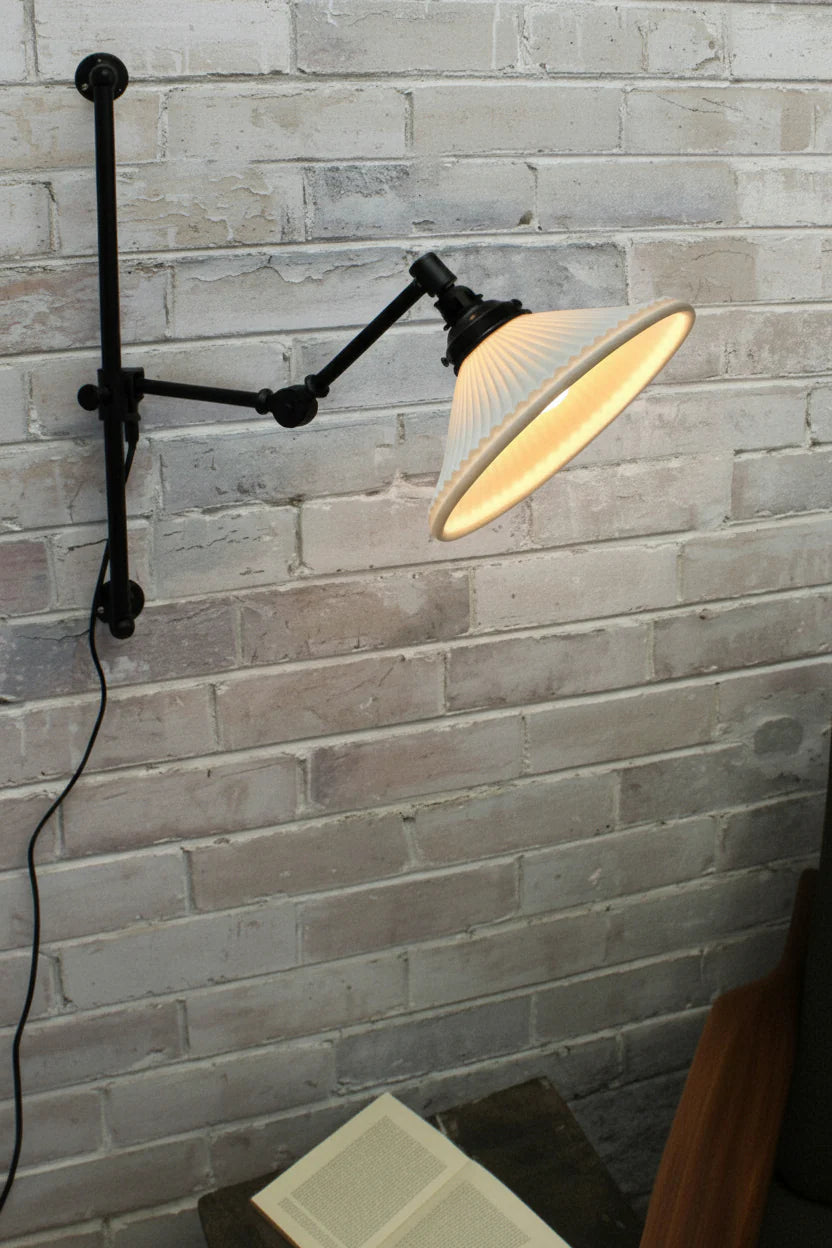Swing arm wall light with ceramic shade and wall plug