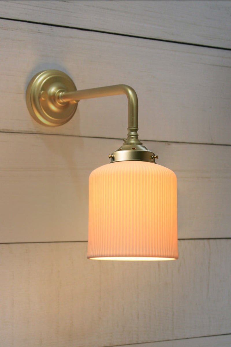 Portofino Ribbed Ceramic 90 Degree Wall Light in gold/brass.