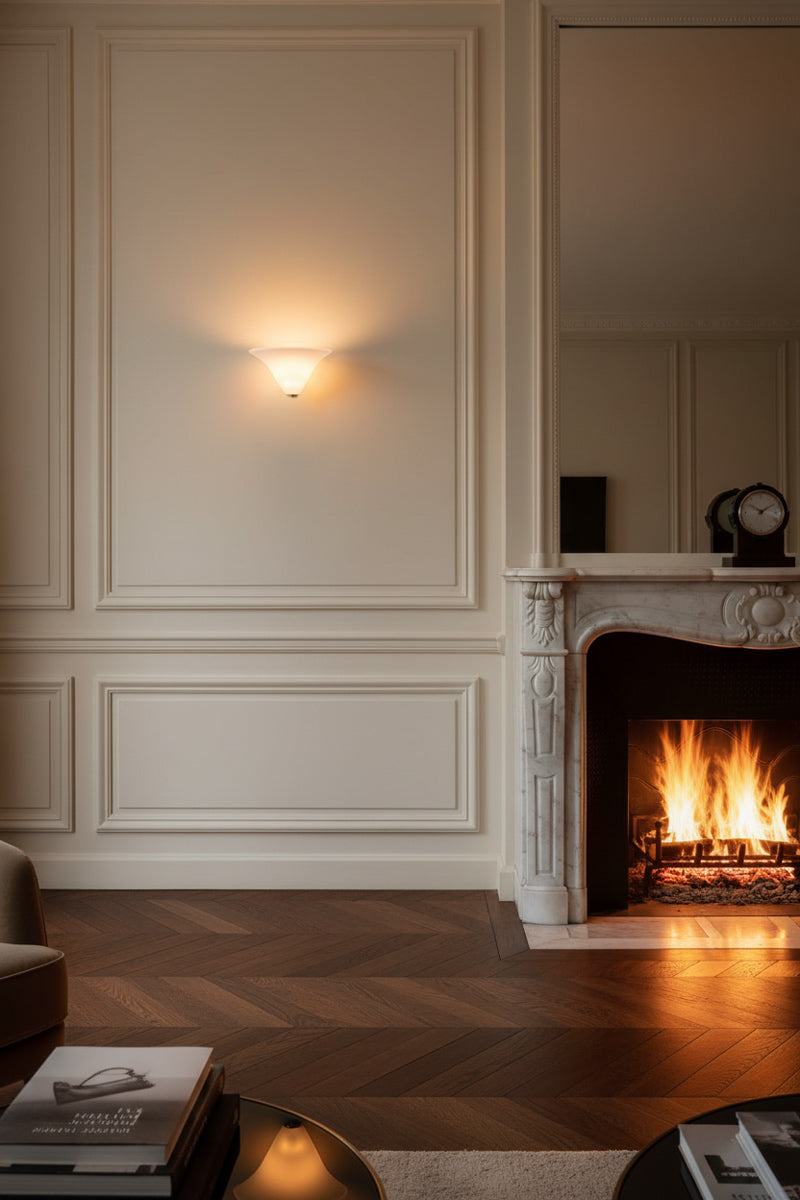 Acid frost glass wall light net to a marble fireplace. 
