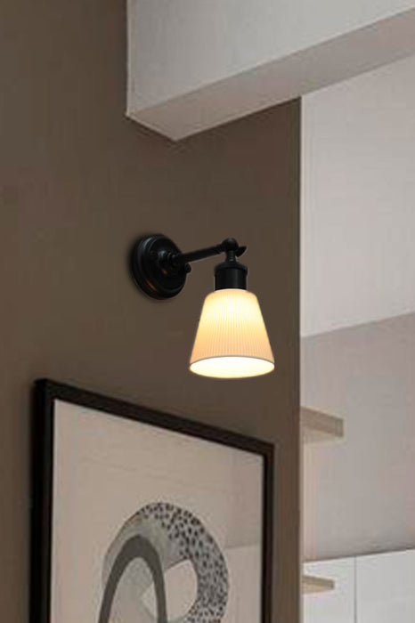 Swivel arm wall light with black sconce