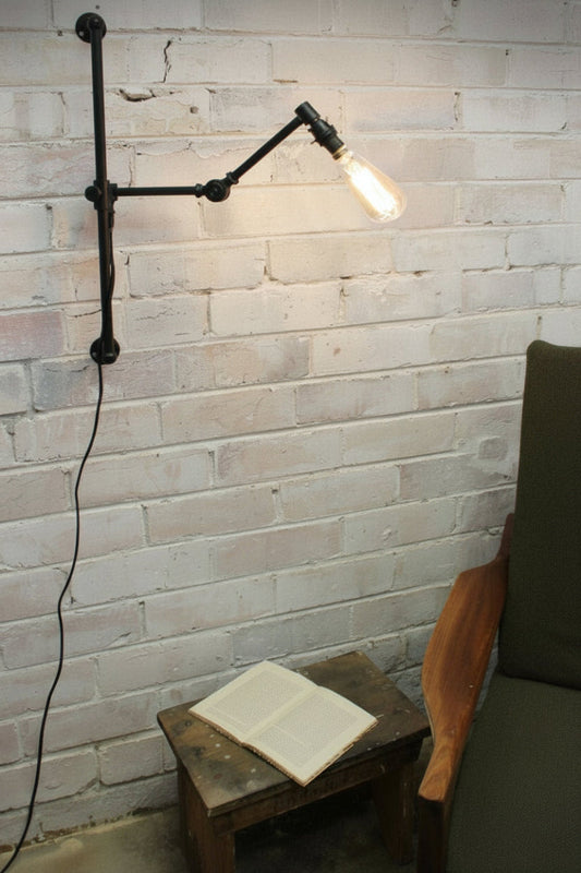 Swing arm wall light