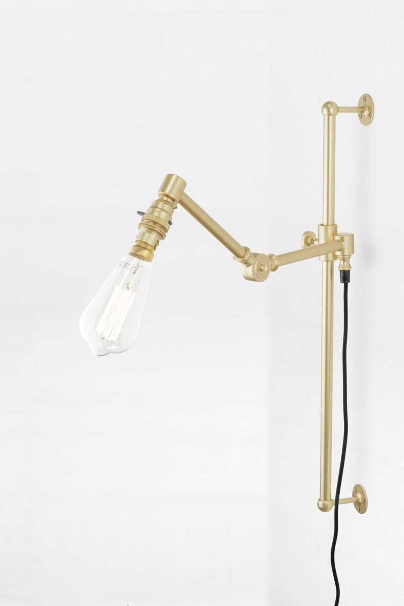 Swing Arm Light Fixture with Wall Plug in Brass Gold Finish and black cord. 