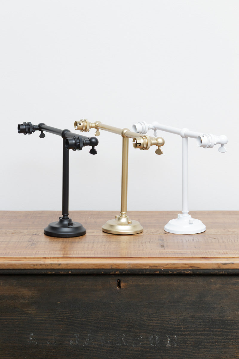 Black, gold/brass and white finished double swivel lampholder wall sconces. 