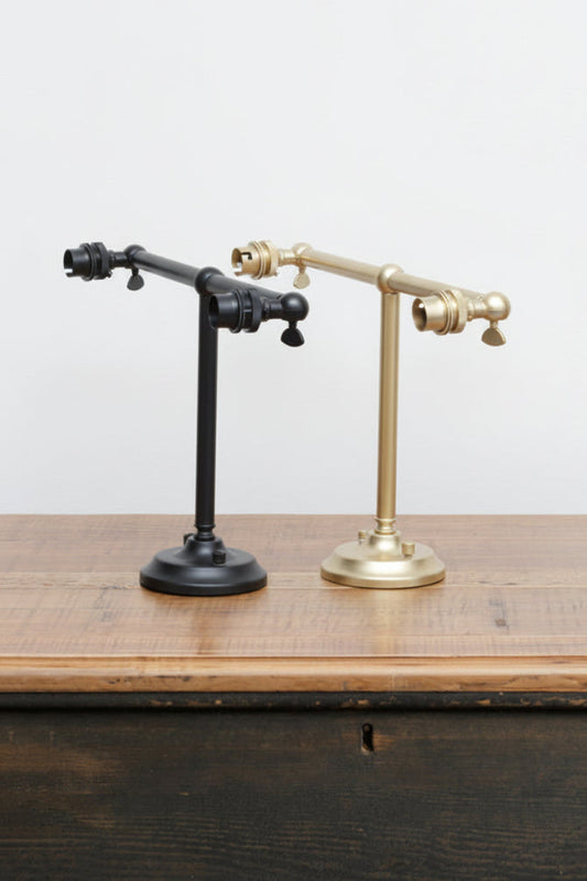 B22 double swivel steel wall sconce in black and gold/brass finishes. 