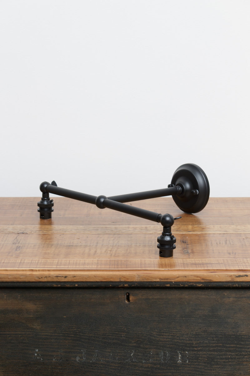 Black B22 steel double swivel wall sconce.