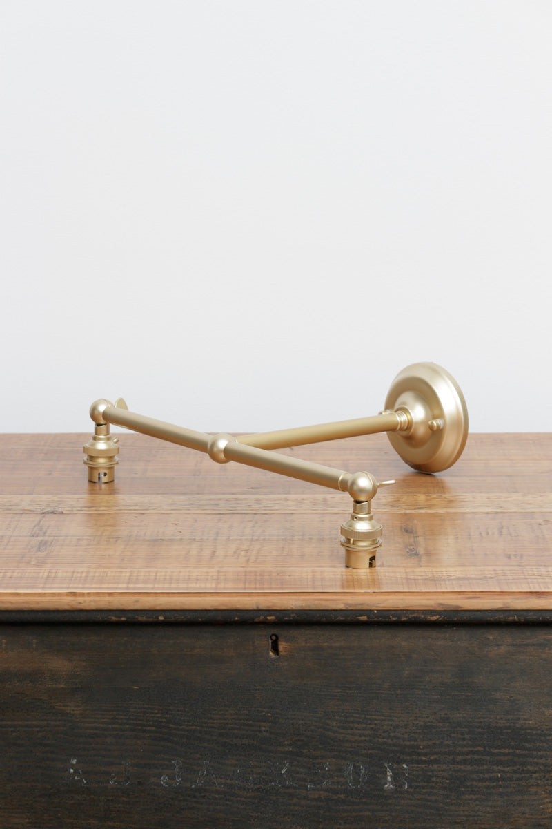Gold/brass B22 steel double swivel wall sconce.
