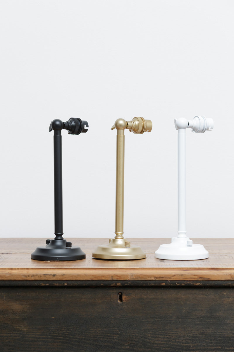 3 steel long straight arm wall sconces in black, gold/brass and white