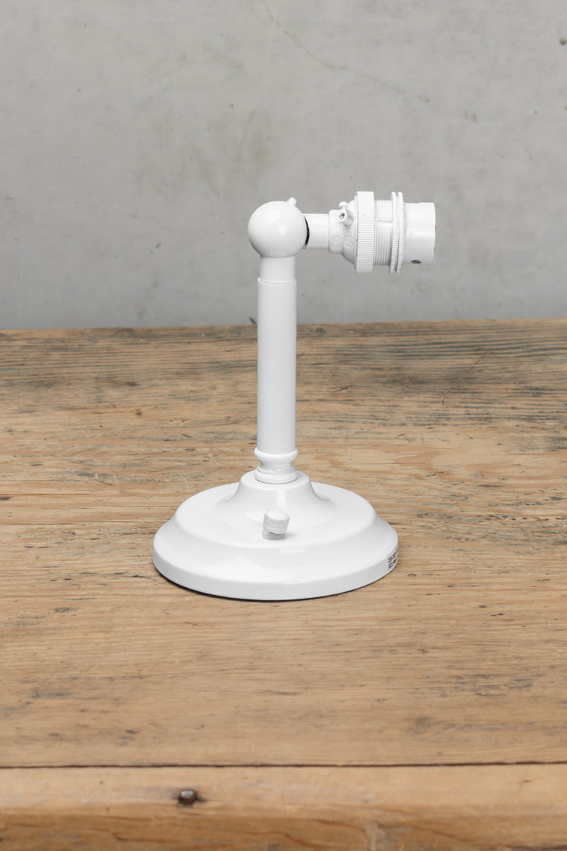 Short B22 wall arm in a white finish