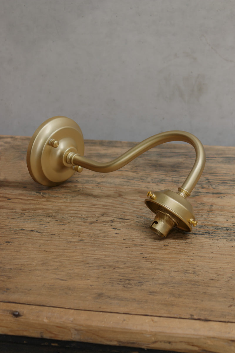 Gold/brass outdoor wall sconce with integrated 2 1/4 inch cup. 