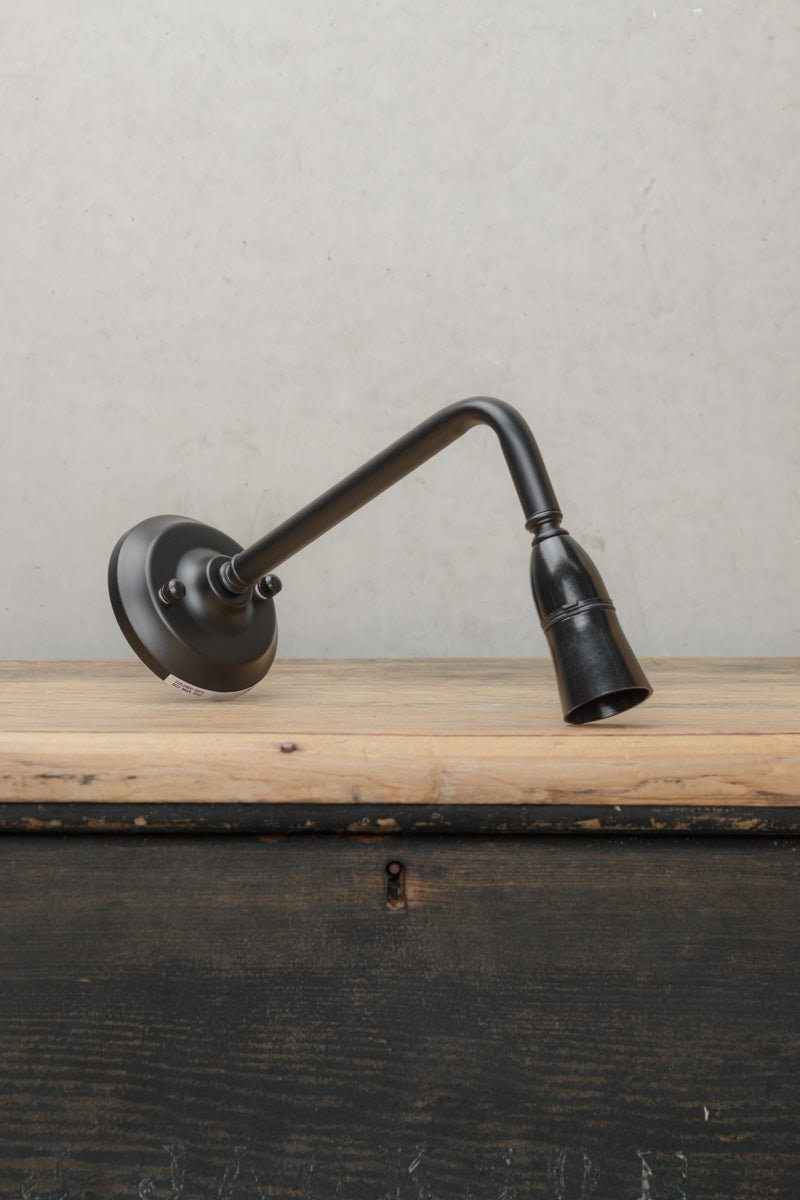 90 Degree outdoor wall sconce in black with a B22 lampholder. 