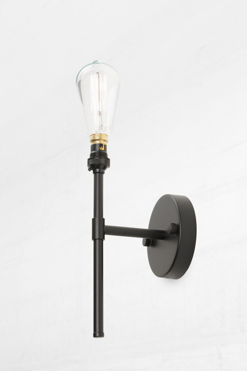 Stem wall light classic form and finish.