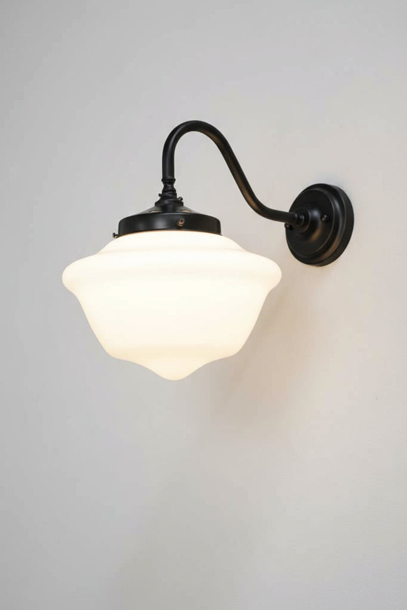 Small Chelsea opal choolhouse shade on a black steel, gooseneck wall sconce.