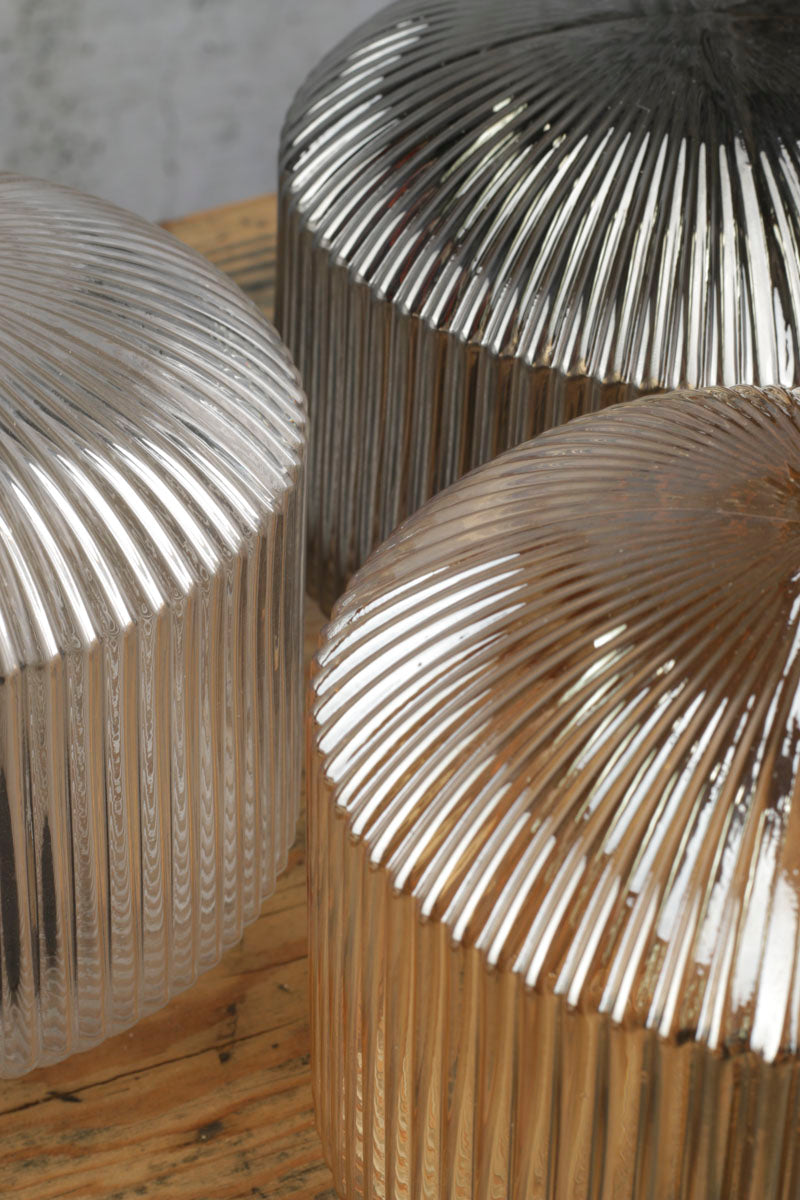 Close up of the three reeded glass shade finishes. 