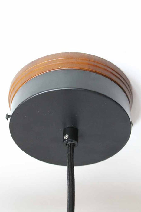 Wooden mounting block with black metal ceiling rose and black pendant cord.