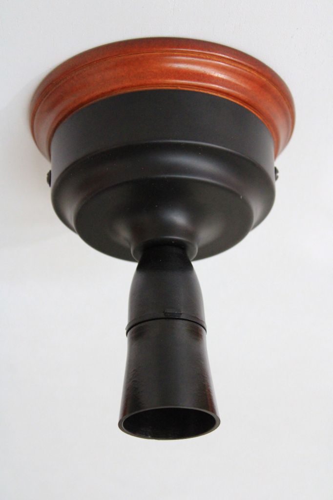 ceiling light fixture in black with wooden mounting block