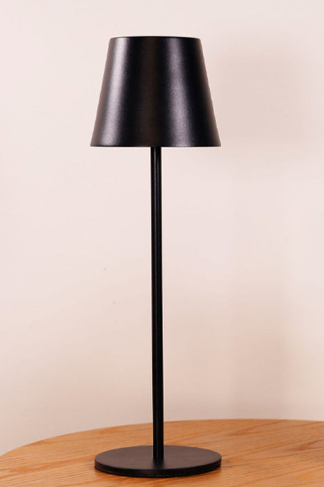 Black table lamp over desk