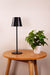 Black LED table lamp over a coffee table