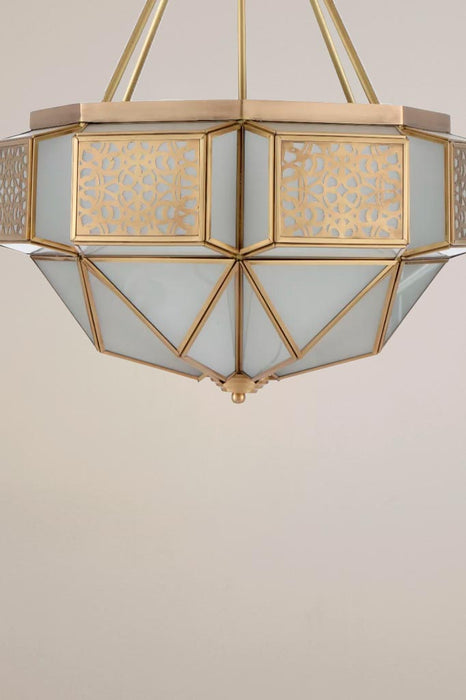 Brass pendant light showcasing an intricate lattice pattern