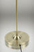 close up of the base of the gold/brass floor lamp
