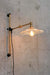 gold brass arm with glass shade