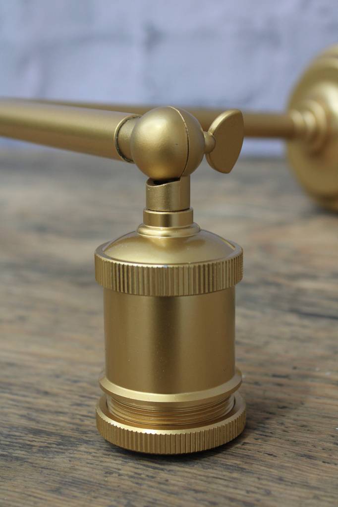 Gold/brass steel double swivel wall sconce, close up of the lampholder  