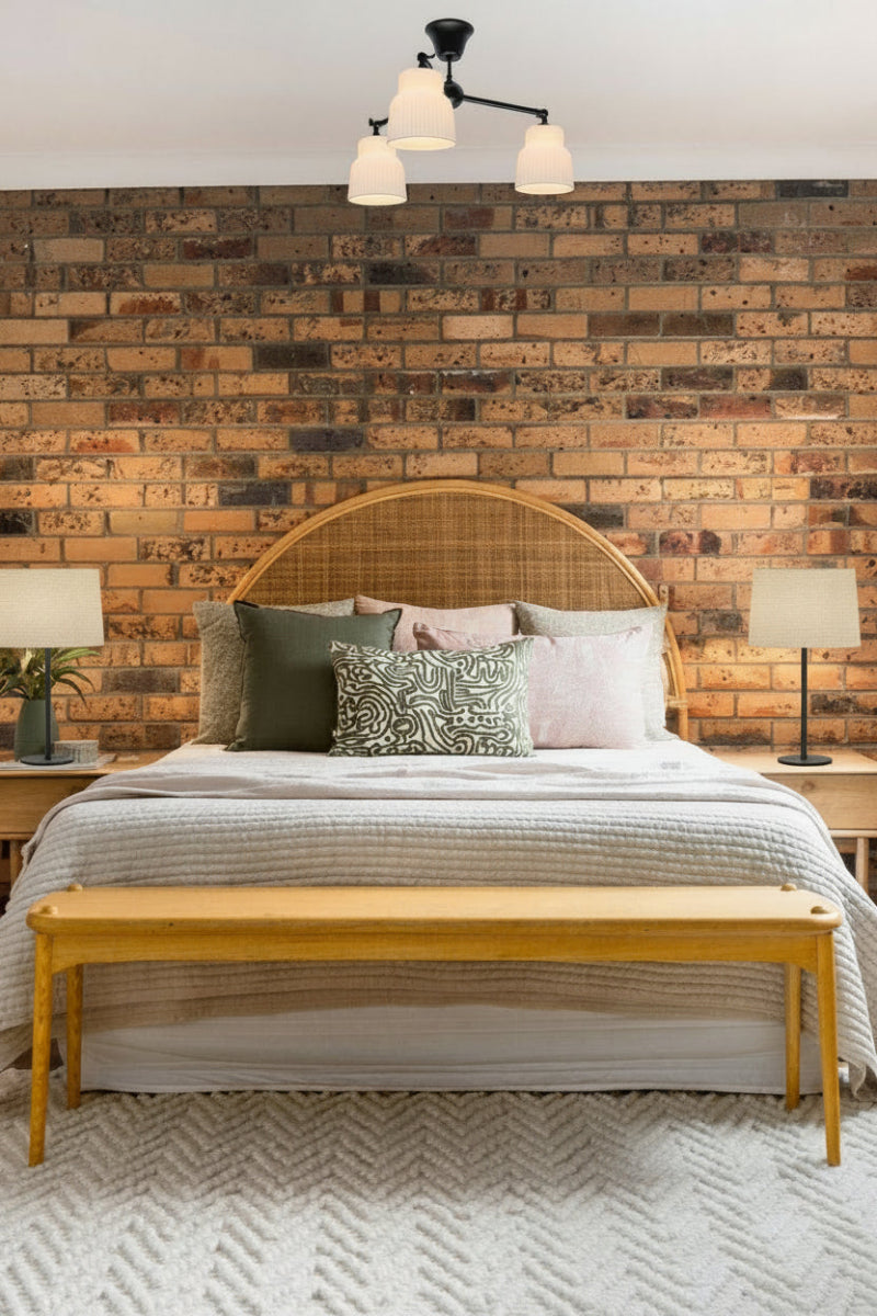 A black steel three arm flush mount fixture with three Verona ceramic  shades hanging in a bedroom.