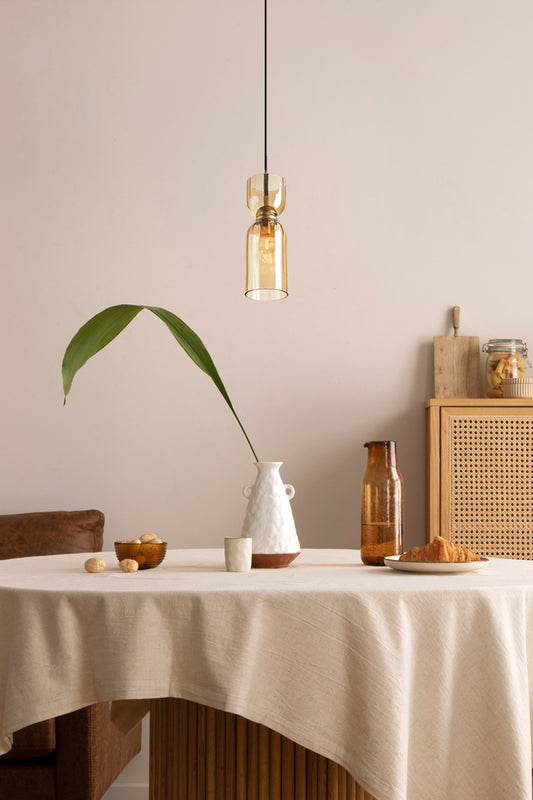amber glass pendants over dining tabel