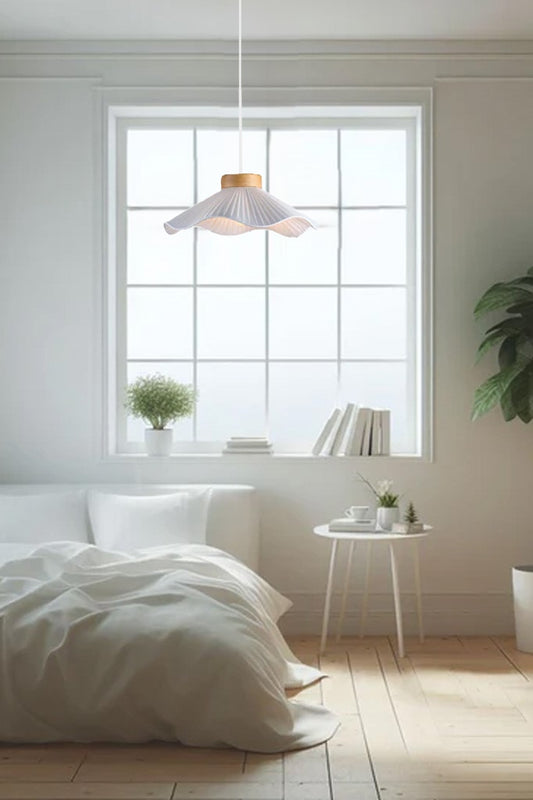 Small white pleated pendant light in a bedroom