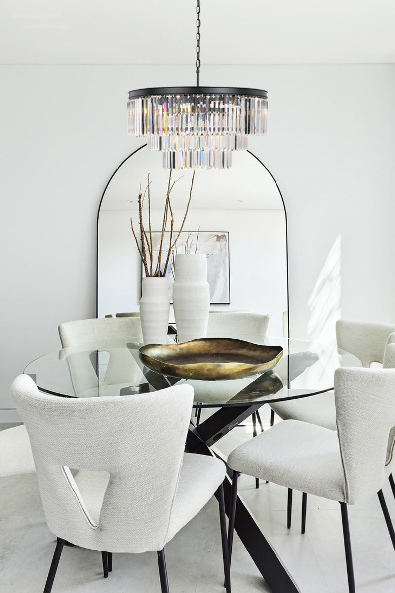 Crystal 3 tiered pendant light over a modern dining space. 