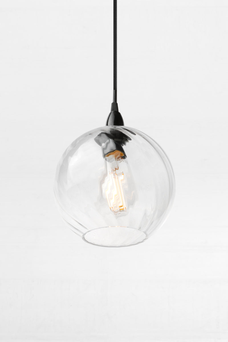 Kansas clear glass pendant light with rounded twisted globe shade, exposed bulb and black pendant cord