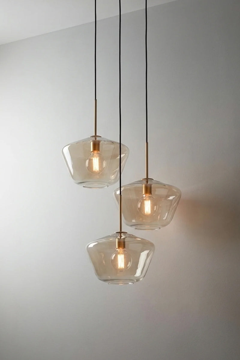 Lugano Glass Multi Drop Pendant – Shade A three drop pendant with gold/brass pendant cords and champagne glass shades