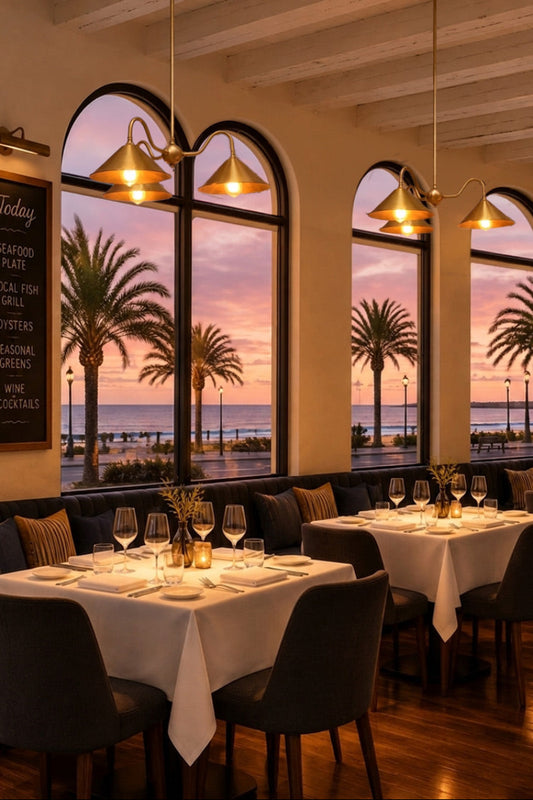 Gold brass Cone Gooseneck Chandelier in a restuarnt hanging over tables. Modern beachside vibe