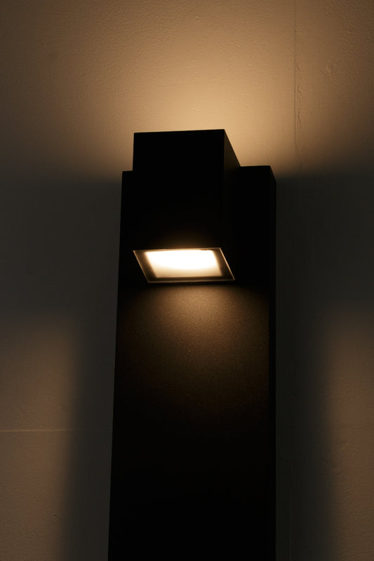 Modern rectangular outdoor light fixture provides both uplight and downlight