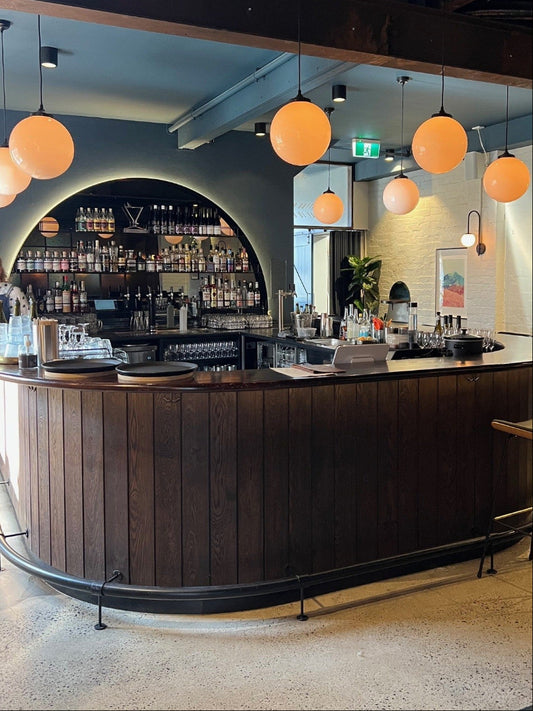 pendant lights with glass sphere at bar in Fitzroy Melbourne