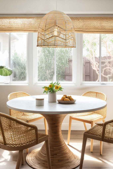 Beechmont Rattan Pendant over a dining table.