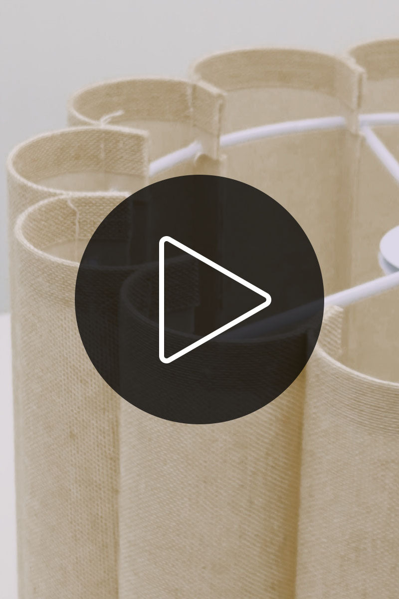 Video showcasing the small fabric Trenerry shade in a white space. 