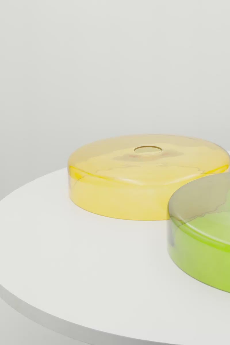 video of two coloured glass shades in amber and green