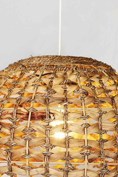 Close up of the rattan shade with white cord