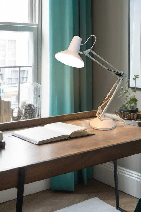 White desk lamp over an office desk