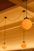 glass ball pendant light hanging in a restaurant