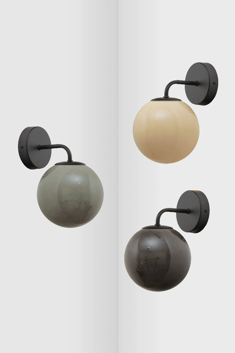 GIF of the three Boise glass ball wall lights in all finishes, showing what the colour tone difference is when illuminated and not illuminated. 