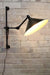black arm wall sconce with black large shade