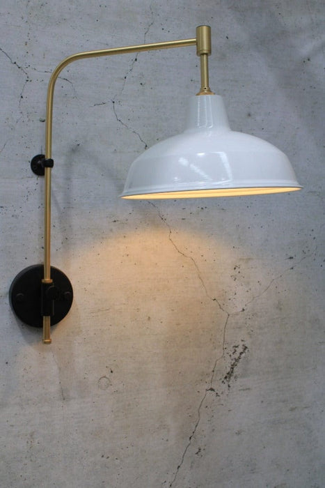 warehouse shade white with gold arm sconce